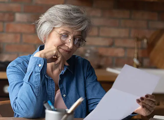 Senior woman reading a letter